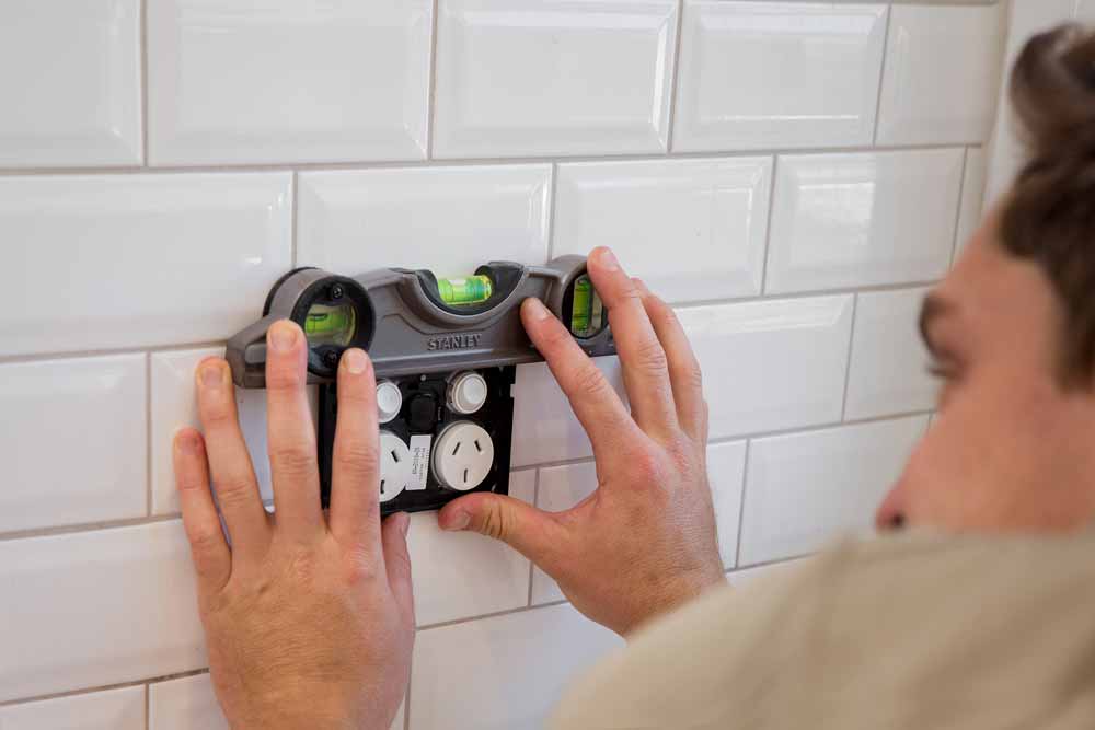 A local Wollongong electrician installing a new GPO in Corrimal